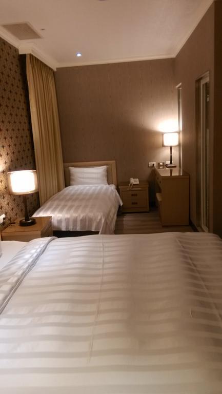 A Casa Hotel Taoyuan Rom bilde